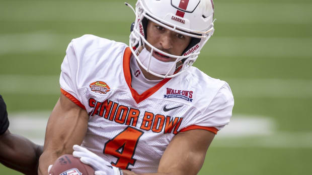 Feb 2, 2023; Mobile, AL, USA; National wide receiver Michael Wilson of Stanford (4) grabs a touchdown as he practices during the third day of Senior Bowl week at Hancock Whitney Stadium in Mobile.